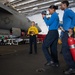 U.S. Sailors simulate overhauling a fire on an F/A-18E Super Hornet