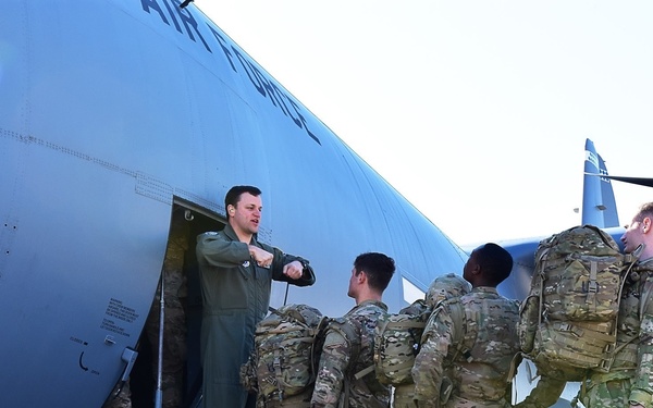 Paratroopers load C-130