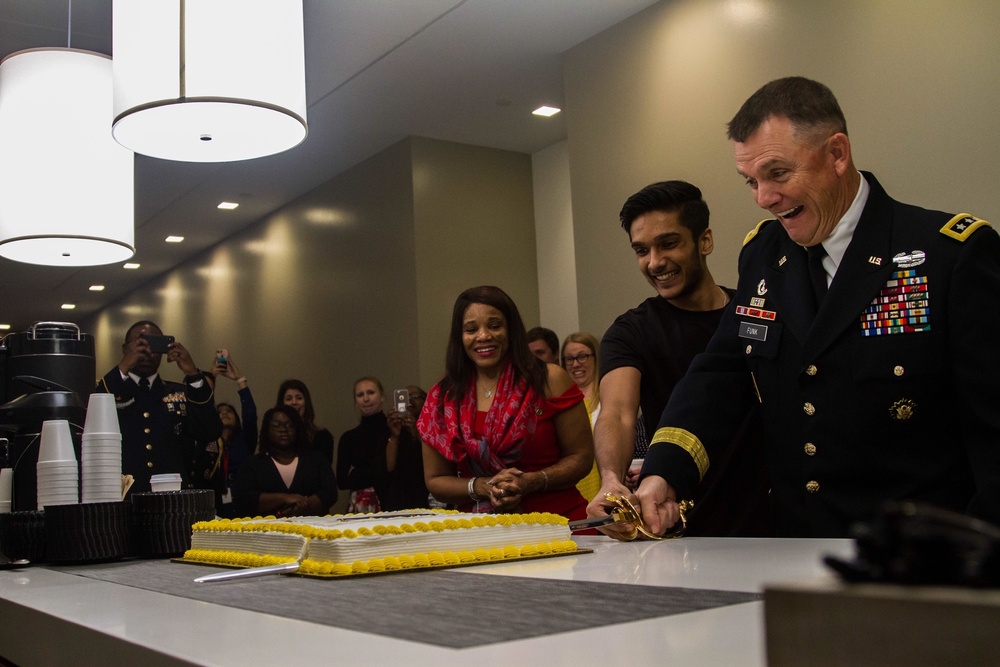 New Army recruit celebrates enlistment with cake cutting ceremony