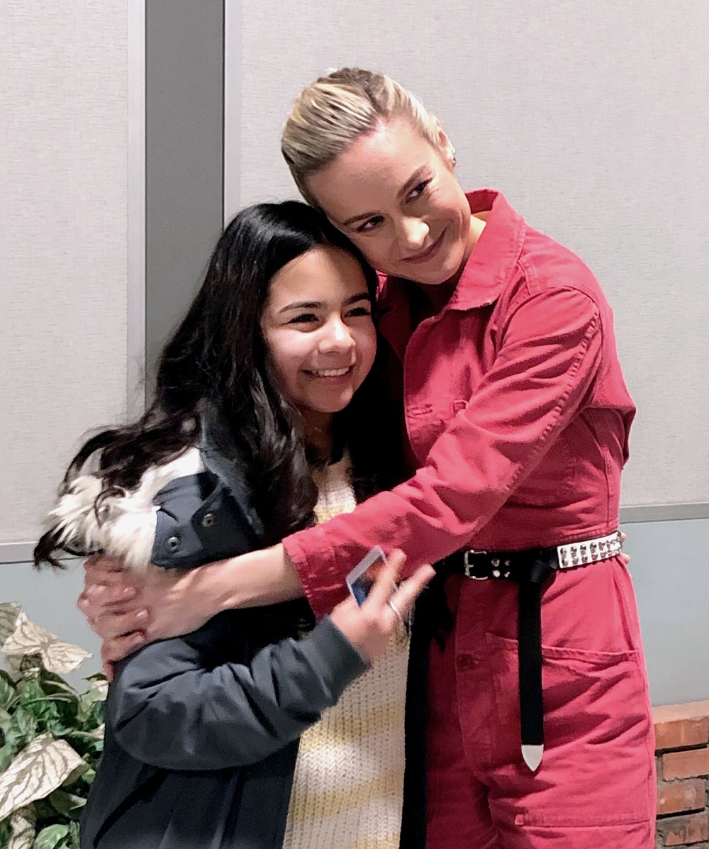 Captain Marvel with military child