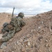 U.S. Army Soldier Climbs Hill to Look for Simulated Enemies