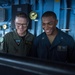 U.S. Navy Rear Adm. Michael Wettlaufer, commander of Carrier Strike Group (CSG) 3, visits with the crew of the guided-missile cruiser USS Mobile Bay