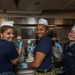 U.S. Sailors pose for a photo during an ice cream social event