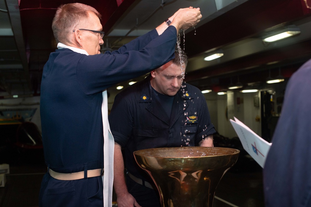 U.S. Sailors participate in baptism