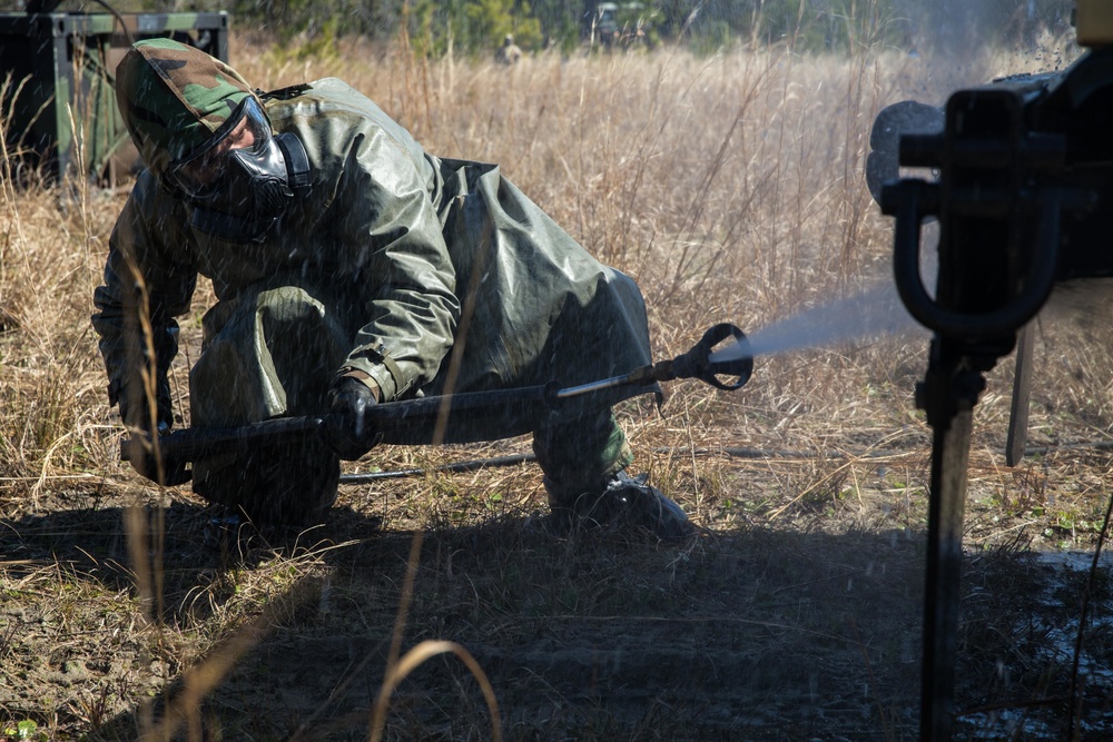 Marines train to decontaminate equipment exposed to simulated chemical agents.