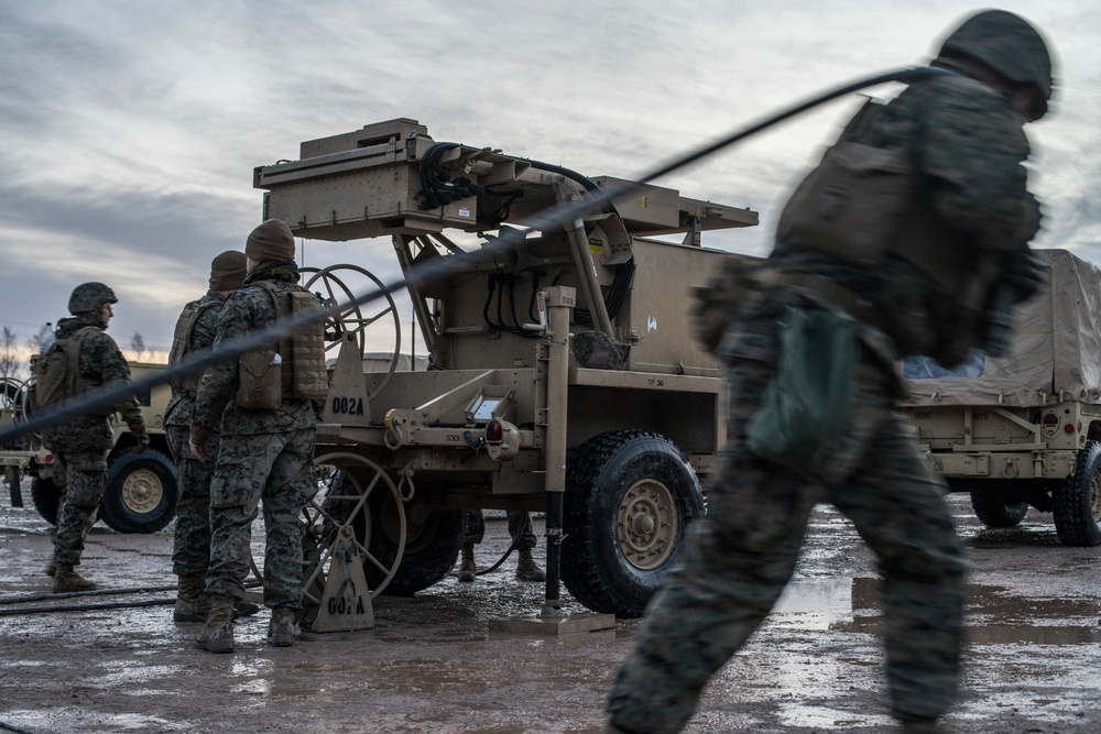 Marines from Headquarters Battery, 14th Marines set up an AN/TPQ-46 Fire-Finder