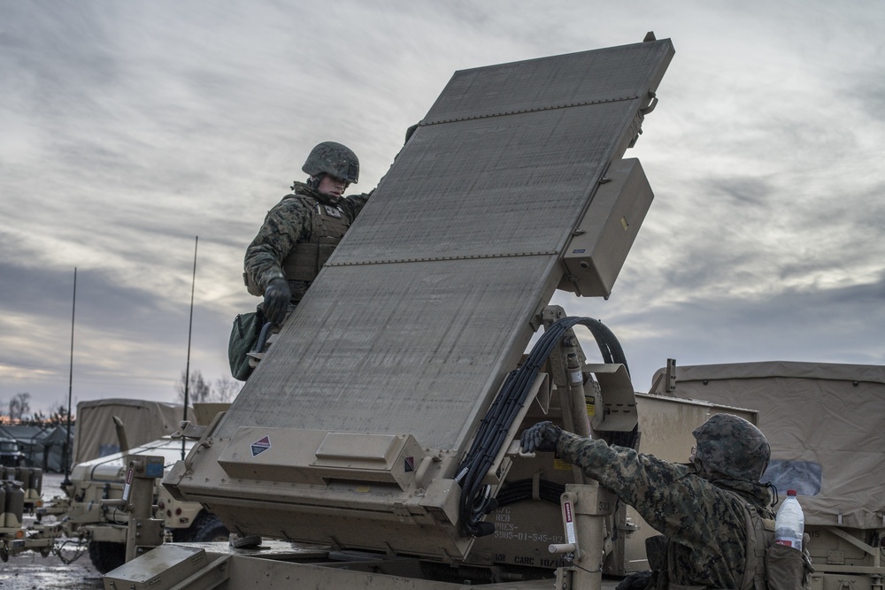 Marines from Headquarters Battery, 14th Marines set up an AN/TPQ-46 Fire-Finder