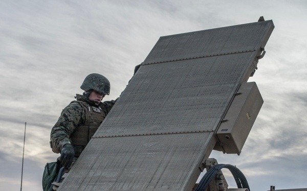 Marines from Headquarters Battery, 14th Marines set up an AN/TPQ-46 Fire-Finder