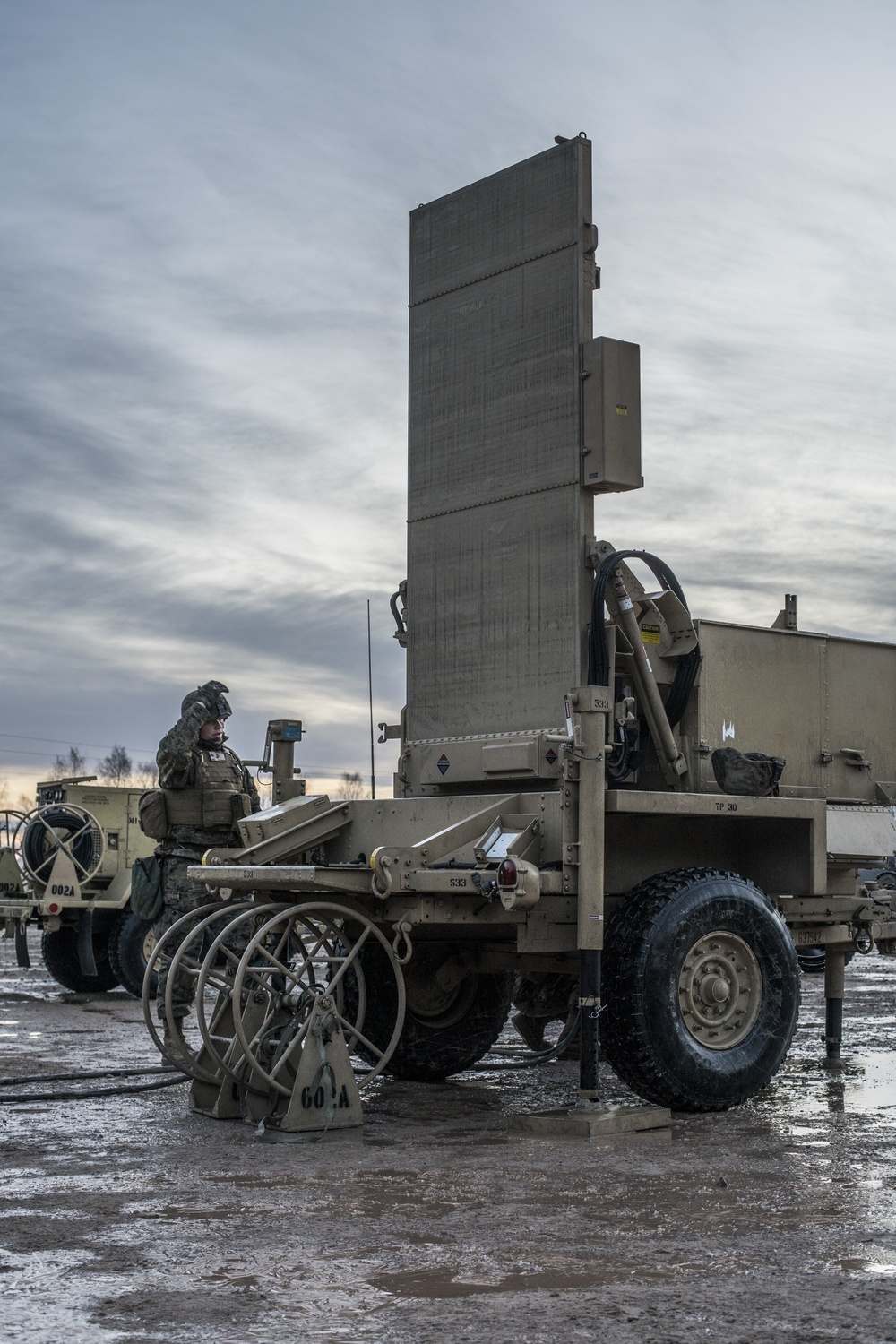 Marines from Headquarters Battery, 14th Marines set up an AN/TPQ-46 Fire-Finder