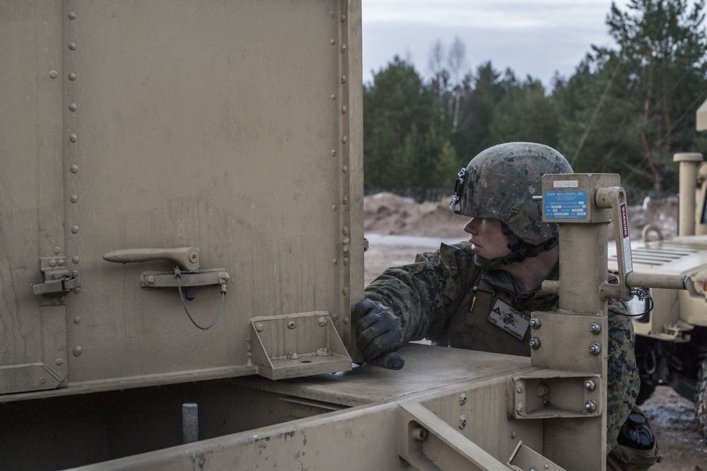 Marines from Headquarters Battery, 14th Marines set up an AN/TPQ-46 Fire-Finder