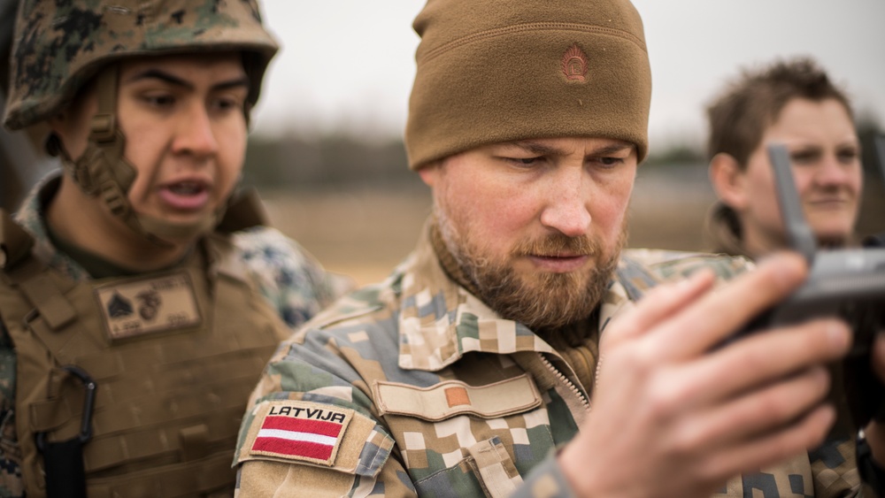 Latvia Army COMCAM and U.S. Marine COMMSTRAT photograph HIMARS shoot