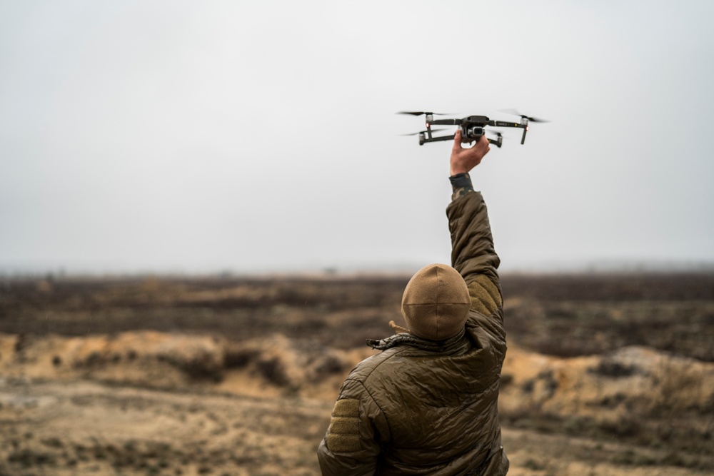 Latvia Army COMCAM and U.S. Marine COMMSTRAT photograph HIMARS shoot