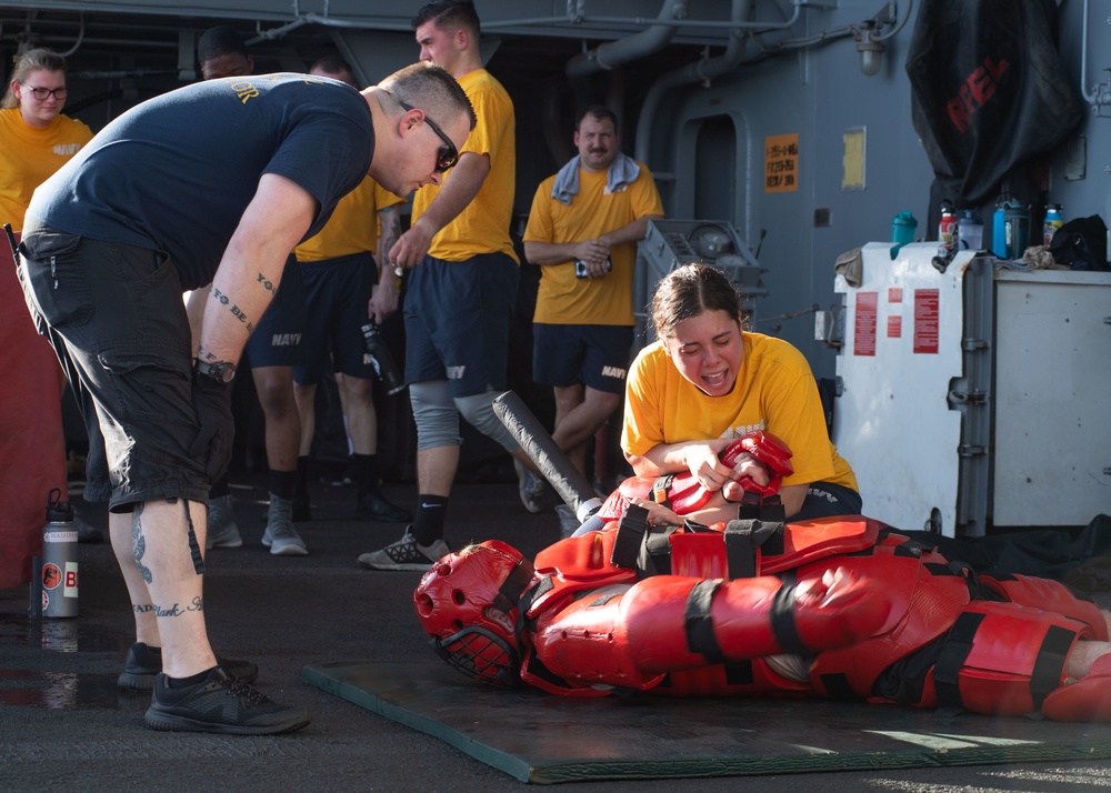 U.S. Sailors participate in an Oleoresin Capsicum (OC spray) training course