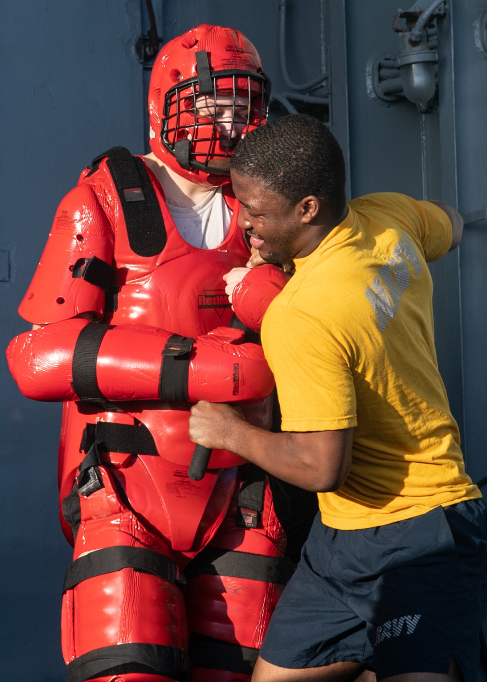 U.S. Sailors participate in an Oleoresin Capsicum (OC spray) training course