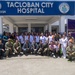 Participants in Pacific Partnership 2019 Subject Matter Exchange at Tacloban City Hospital Pose for Photo