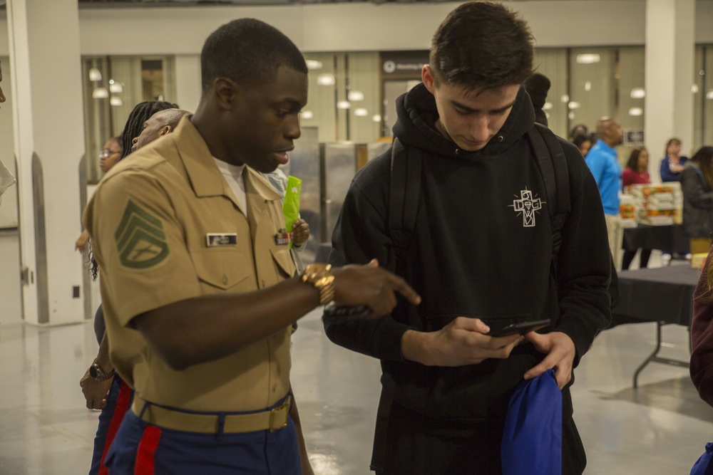 Marines interact with attendees at MEAC college fair