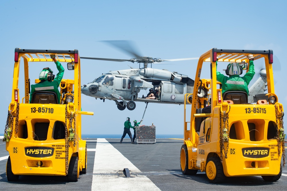The aircraft carrier USS John C. Stennis (CVN 74) conducts a vertical replenishment