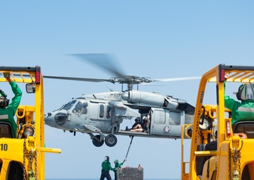 The aircraft carrier USS John C. Stennis (CVN 74) conducts a vertical replenishment
