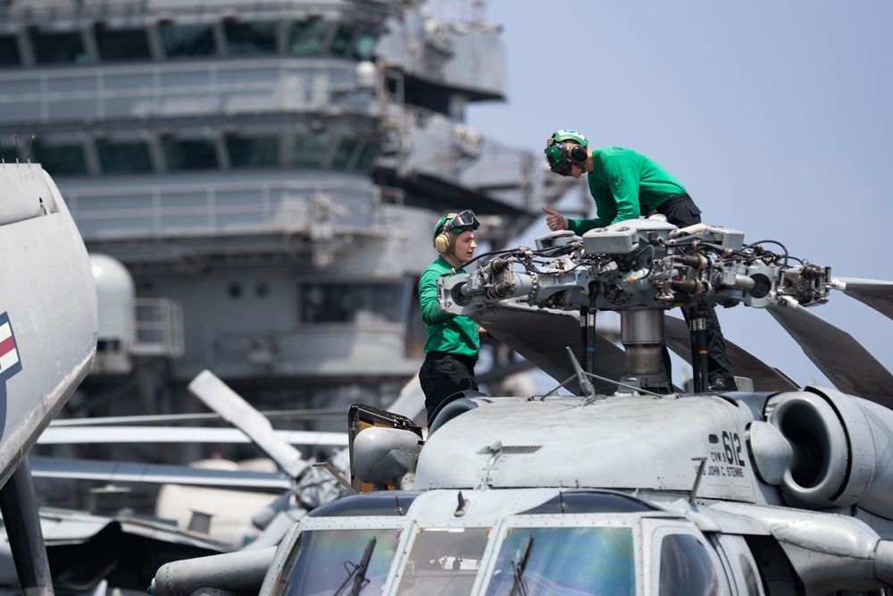 U.S. Sailors conduct maintenance