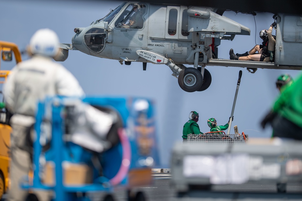 The aircraft carrier USS John C. Stennis (CVN 74) conducts a vertical replenishment