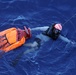 U.S. Navy Sailors recover a simulated man overboard during a man overboard drill aboard USS Spruance.