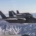 Two F-35C's Fly Over Snow Covered Sierra Mountains