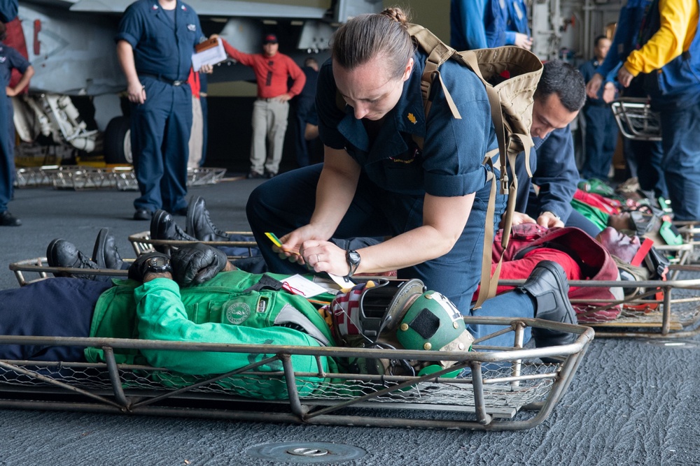 U.S. Sailors participate in a mass casualty drill