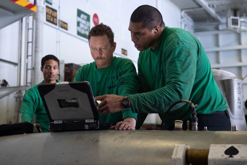 U.S. Sailors troubleshoot an aerial refueling store