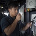 U.S. Navy Sailors Stand watch in the pilot house aboard the USS Spruance.