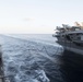 The USS Spruance conducts a replenishment-at-sea with the aircraft carrier USS John C. Stennis.