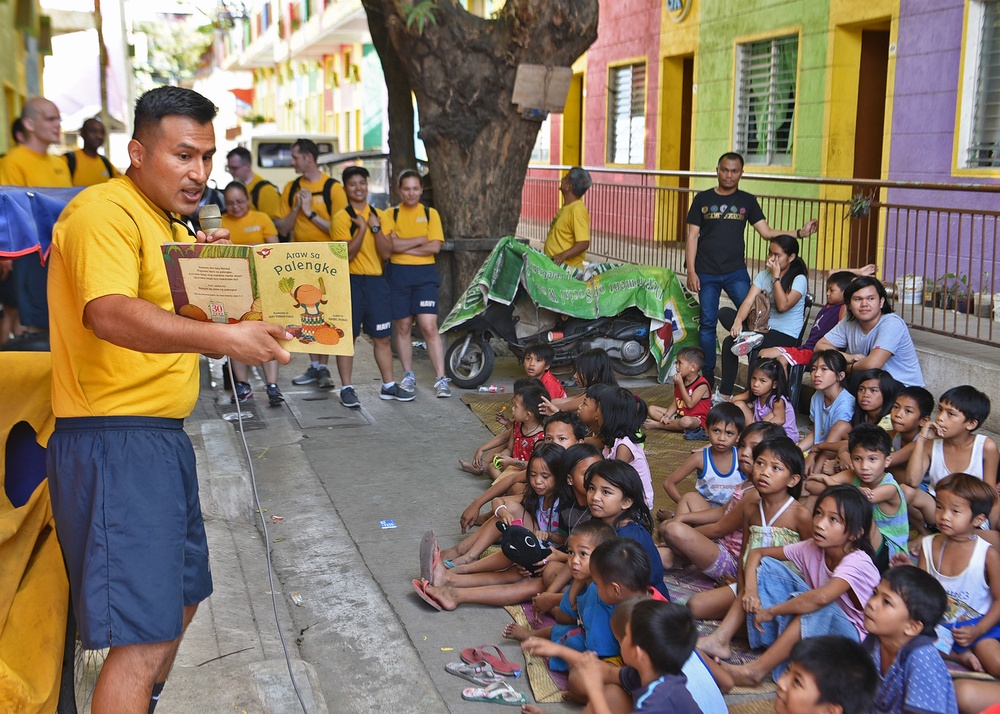 C7F/Blue Ridge Sailors participate in a community relations event at Gawad Kalinga Munting Pamayanan