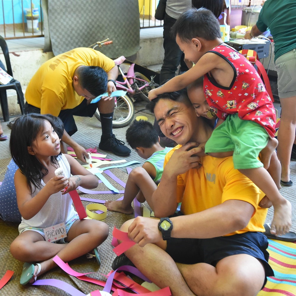 C7F/Blue Ridge Sailors participate in a community relations event at Gawad Kalinga Munting Pamayanan