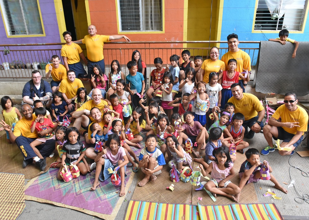 C7F/Blue Ridge Sailors participate in a community relations event at Gawad Kalinga Munting Pamayanan