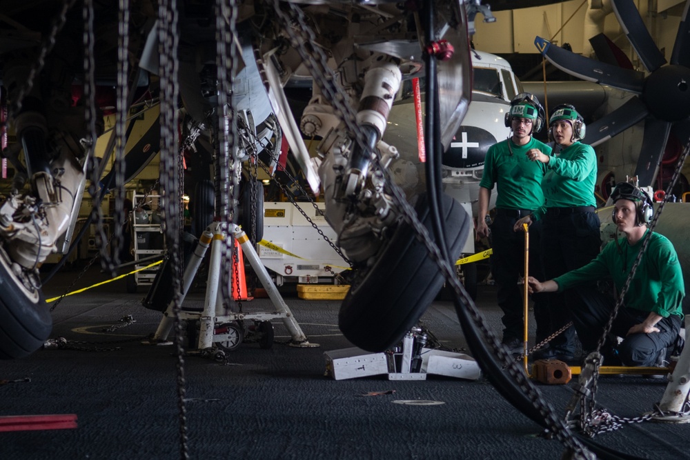 U.S. Sailors conduct an operational check of landing gear