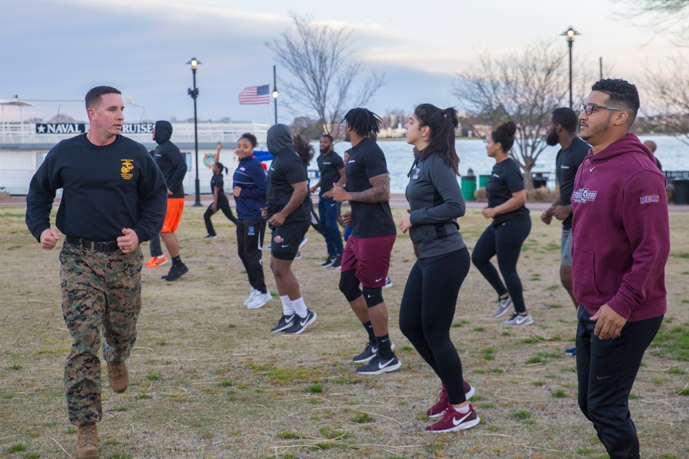 Marines teach leadership during a wake up and work out