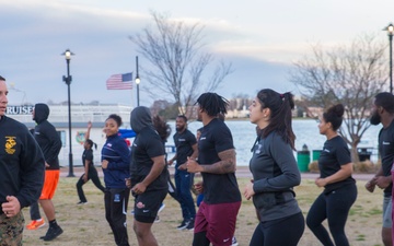 Marines teach leadership during a wake up and work out