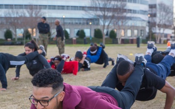 Marines teach leadership during a wake up and work out