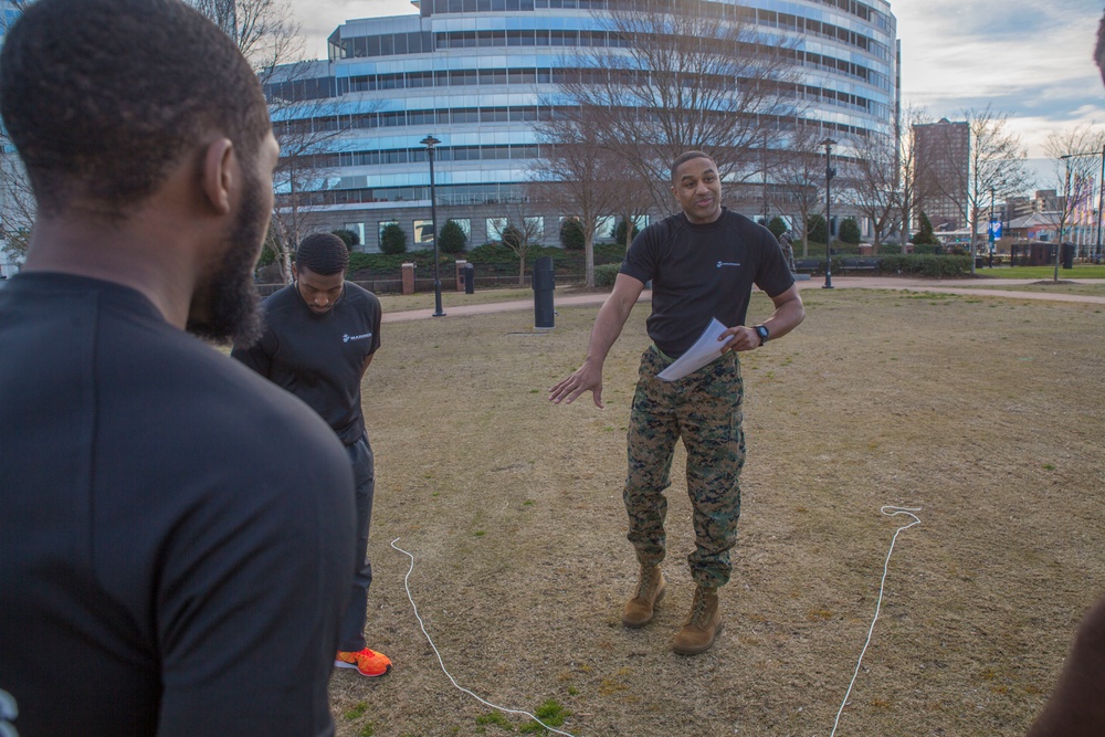 Marines teach leadership during a wake up and work out