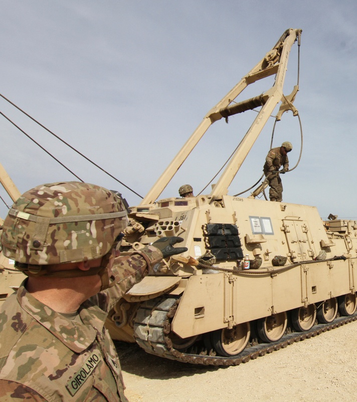 A platoon sergeant conducts familiarization training on an M88A2 Heavy Equipment Recovery Combat Utility Lifting Extraction System at Mihail Koglaniceanu Air Base, Romania