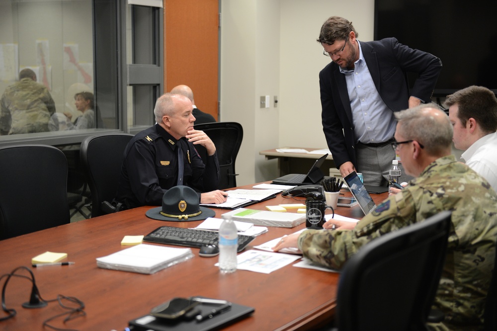 State Emergency Operations Center officials discuss flood operations