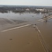 A section of road is underwater stranding a vehicle near Waterloo, Nebraska