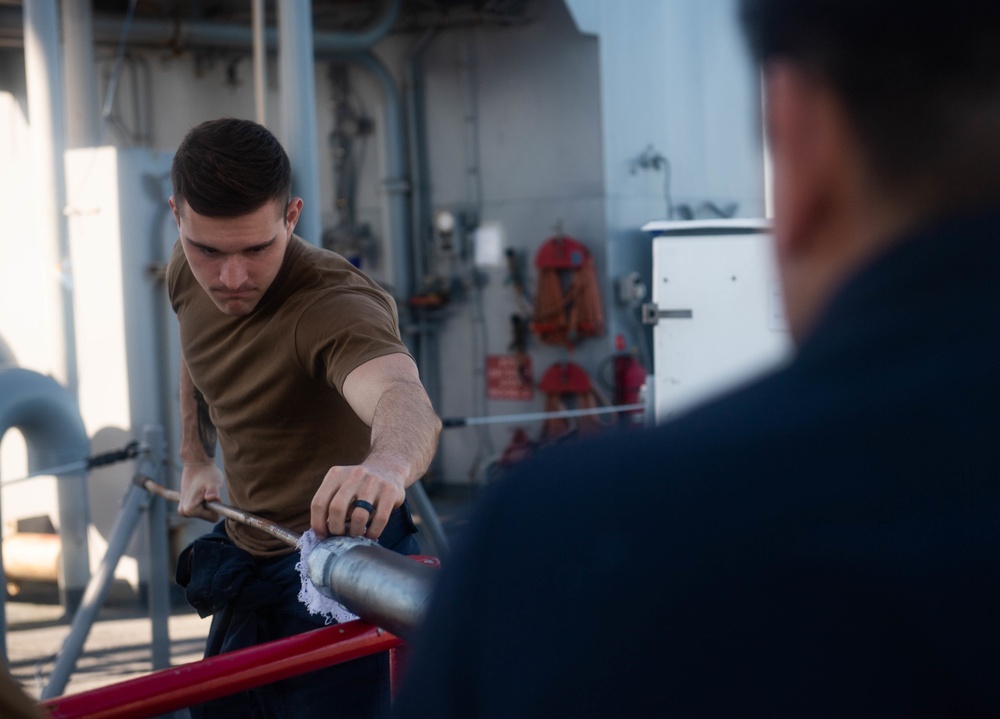 Sailors Perform Maintenance Aboard USS Harpers Ferry