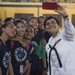 Musician 3rd Class T'anna Tercero, assigned to the U.S. 7th Fleet Band, captures a selfie with students at the Tuloy Foundation