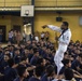 Musician 3rd Class Jared Goodrum, assigned to the U.S. 7th Fleet Band, performs for students at the Tuloy Foundation