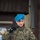 20th anniversary of NATO expansion A Polish military officer is speaking at a podium during an official ceremony. The podium bears the insignia of the XVI Polish Military Contingent serving under EUFOR ALTHEA, the EU-led peacekeeping mission in Bosnia and Herzegovina. The officer is wearing Polish camouflage uniform with a blue beret, consistent with UN/EU peacekeeping dress.