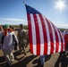 Skardon walks w American flag