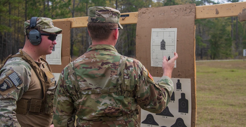 Georgia Army National Guardsmen discuss shot groupings during battlesight zero training 
