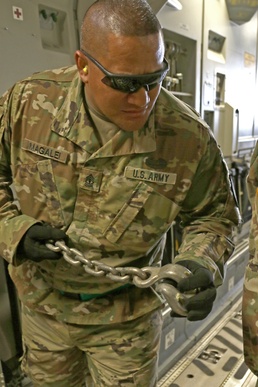 Magalei prepares the tie