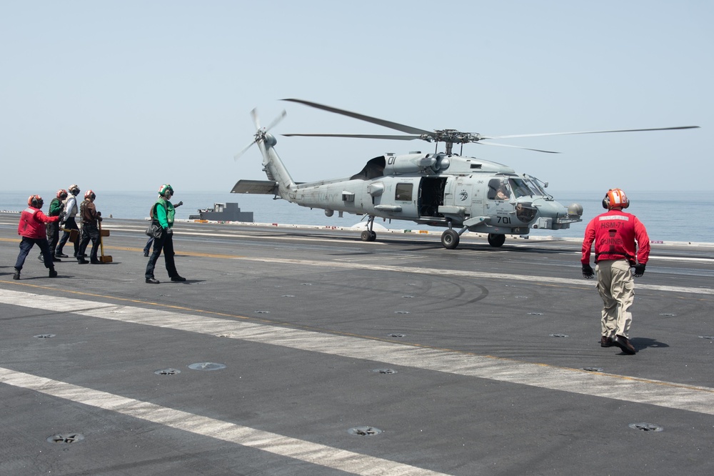 An MH-60R Sea Hawk lands on the flight deck