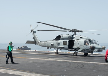 An MH-60R Sea Hawk lands on the flight deck
